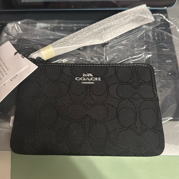 Coach Handbags - Coach Outlet Signature Zip Wristlet -new!